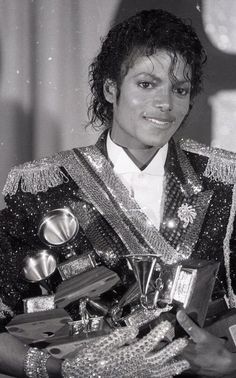 michael jackson in his elvis costume holding trophies