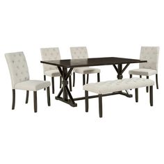 a dining room table and chairs with white fabric upholstered seats on the side