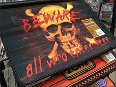 a sign with a skull and bones on it that says beware all who observe