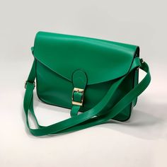 Cross Body Satchel Color: Green Size: One Size Condition: Nwt Product Details: This Stylish Faux Leather Cross-Body Bag Is An Intense Green With Gold Hardware Detail. It Has A Back Pocket, Perfect For Holding Your Smartphone. Satchel Style Cross-Body Strap Fold-Over Flap Top Buckle Detail Exterior Pocket Faux Leather Imported Classic Green Bags For Spring, Classic Green Bag For Spring, Casual Green Satchel For Office, Everyday Green Satchel With Hasp Closure, Cross Body Satchel, Leather Cross, Body Bag, Leather Crossbody Bag, Green And Gold