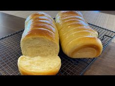 two loaves of bread on a cooling rack