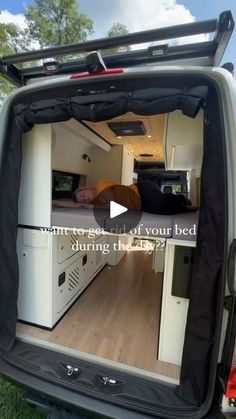 the back end of an rv with its bed in it's rear door open