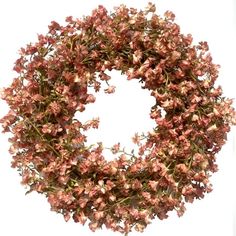 a wreath with pink flowers hanging from it