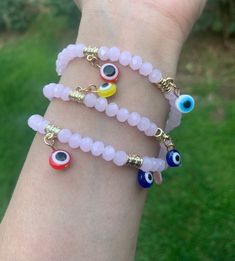 Evil Eye 🧿 Beaded Bracelet In many cultures, it is believed that evil eye bracelets protect against misfortune, evil looks and negative energy. Wear your bracelet for good luck and protection. ✨ Pink Evil eye protects your friendships and exhibits a calming, relaxing feeling. ✨ Pink Spiritual Jewelry With Evil Eye, Pink Evil Eye Spiritual Jewelry, Pink Spiritual Evil Eye Jewelry, Pink Evil Eye Bracelets With Round Beads, Pink Bracelets With Evil Eye Round Beads, Pink Beaded Bracelets With Evil Eye, Pink Evil Eye Round Beads Bracelets, Pink Beaded Bracelet With Evil Eye, Pink Evil Eye Bracelet With Round Beads