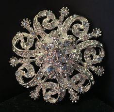 "Rhinestone Brooch - Crystal Brooch Pin - Vintage Style Brooch- Perfect For Bridal Wedding Bouquets - Bridal Sash This listing is for 1 Beautiful Rhinestone Crystal brooch.  The setting is silver tone. This elegant brooch has such a sparkling beauty to it Vintage Style. This Brooch can be used for Bridal bouquets, Ring Bearer Pillow, Wedding cake, Bridal Sash, Bridesmaid Sash, add it to a Hair Comb,  and or even some Ribbon to make a Headband for your Special Event. This Sparkles and Shines so B Make A Headband, Bridesmaid Sash, Vintage Rhinestone Brooch, Ring Bearer Pillow, Wedding Brooch, Brooch Bouquets, Bridal Sash, Wedding Belts, Wedding Bridal Bouquets