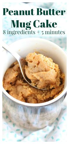 a close up of a spoon in a bowl of food with the words peanut butter mug cake