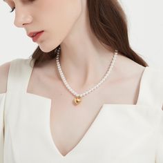 Round of pearl and heart charm necklace. This necklace is perfect for any occasion, even when you don't have one! ………………………………….D E T A I L S• Materials: Stainless steel, 18k gold plating.• Length: 14 inches (35 cm) + extension 2 inches (5 cm)• This product is hypoallergenic, water and tarnish resistant White Pearl Chain Heart Necklace, Heart Necklace With Pearl Chain For Gift, White Pearl Clavicle Chain Necklace For Valentine's Day, White Pearl Clavicle Necklace For Valentine's Day, Heart-shaped Pearl Clavicle Necklace, Dainty Heart Necklace With Pearl Chain, Valentine's Day White Pearl Clavicle Necklace, Heart Pendant Pearl Necklace For Valentine's Day, Dainty Pearl Heart Necklace