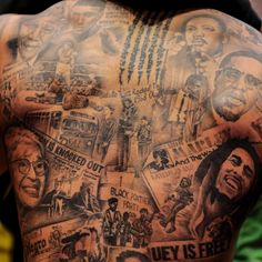 the back of a man with many pictures on his body and chest, all in different colors