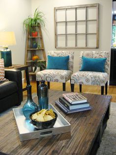 a living room with two chairs and a coffee table