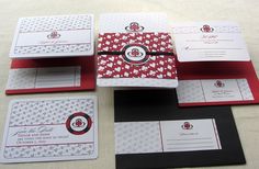 wedding stationery with red and white hearts on the front, black envelopes and matching cards