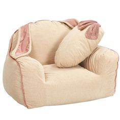 a corded chair with two pillows on it's back and one arm wrapped around the pillow