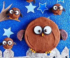 an owl and two owls made out of chocolate frosting on a blue background with stars