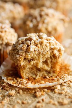 a muffin that has been cut in half and is sitting on top of another muffin