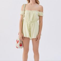 Light Green Off Shoulder Neckline Short Sleeves Bathered Waist With An Adjustable Tie At The Front Button Placket At The Front And Trimmed With Ruffles At The Neckline And Hems Off-shoulder Jumpsuits And Rompers For Spring, Off-shoulder Jumpsuits For Summer Day Out, Summer Fitted Jumpsuits And Rompers By Urban Outfitters, Casual Urban Outfitters Jumpsuits And Rompers For Day Out, Urban Outfitters Cotton Jumpsuits And Rompers For Spring, Casual Summer Jumpsuits And Rompers By Urban Outfitters, Casual Off-shoulder Jumpsuits And Rompers For Brunch, Chic Off-shoulder Jumpsuits And Rompers For Summer, Spring Off-shoulder Jumpsuits And Rompers