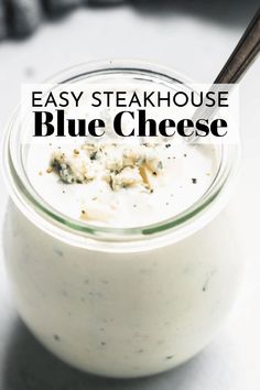 an easy steakhouse blue cheese in a glass jar with a spoon on the side