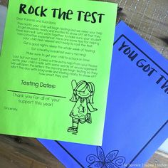 a rock the test book sitting on top of a wooden table