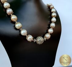 "◎ Statement necklace made from natural freshwater pearls in 4 colors ( white, silver, peach and pink ). Adorned with decorative floral ball element and filigree pearl caps. Everything is handmade from solid sterling 925 silver. ★ ◎ Length: 48 cm ( 18.9\" ) Diameter of the silver ball elements: 1.8 ( 0.70\" ) ◎ Enter the shop, for more of our jewelry, and matching earrings ;) ◎ - - - - - - - - - - - - - - - - - - - - - - - - - - - - - - - - - - - - - - - - - - - - - - - - - - Jewelry will be pac Handmade Formal Bridal Necklace With Round Beads, Handmade Bridal Necklace With Round Beads For Formal Occasions, Handmade Bridal Necklace With Round Beads For Anniversary, Formal Handmade Bridal Necklace With Round Beads, Wedding Akoya Pearl Beaded Necklaces With Round Beads, Handmade Elegant Pearl Necklace With Round Beads, Traditional Silver Pearl Necklace With Round Beads, Traditional Single Strand Pearl Necklace For Wedding, Pearl Necklace With Silver Beads As Gift