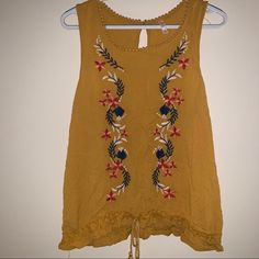 New With Tag (Nwt) Never Worn Xhilaration Size Xxl Mustard Yellow Sleeveless Tank Blouse With Floral Embroidery And Tie Bottom. Yellow Embroidered Beach Top, Floral Embroidered Tank Top For Vacation, Vacation Floral Embroidered Tank Top, Embroidered Yellow Tops For Vacation, Yellow Floral Embroidery Tops For Vacation, Yellow Embroidered Top For Vacation, Yellow Embroidered Top For Beach, Casual Sleeveless Embroidered Top For Vacation, Yellow Bohemian Tank Top For Spring