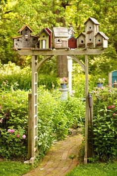 a garden with lots of bird houses on it