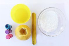 there are some craft supplies on the table including crayons, glue sticks and doughnuts