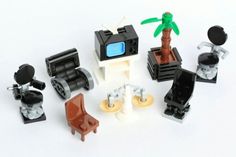 a bunch of legos that are sitting on a table together in front of a palm tree