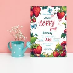 a birthday card with strawberries on it next to a watering can and flower pot