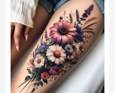 a woman's thigh with flowers on it