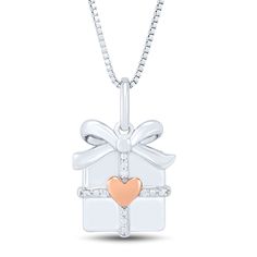 This delightful I Am Love gift box pendant is finely crafted in sterling silver and features a signature heart accent in 14K rose gold and sparkling diamond accents for added shine. | Gift Box Pendant Necklace with Diamond Accents | Sterling Silver and 14K Rose Gold | White | Size 18" | I Am Loved I Am Loved, Sparkle Gift, Necklace With Diamond, Helzberg Diamonds, Rose Gold White, Sparkling Diamond, Holiday Jewelry, Fine Jewelry Gift, White Rose Gold