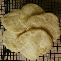 four pieces of bread sitting on top of a cooling rack