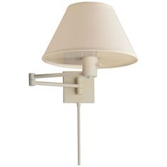 a wall lamp with a white shade on it