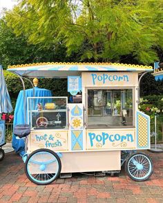 an ice cream cart is parked on the side of the road