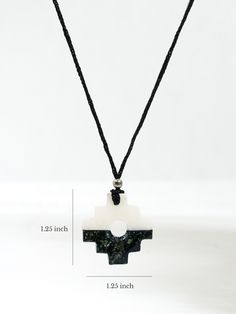 The Andean symbol of the Incan civilization, our chakana talisman necklace is created from black and white stones in a horizontal pattern. Derived from Quechua, the traditional language of the Incas, the word chakay, means to cross or to bridge, between this world and the other worlds. A chakana is a 3-stepped symmetric cross, sometimes with a hole in the center. Strung on a black cord with a silver-tone accent bead. Each item is unique and handmade in Peru. Choice of white top or black top. Traditional Handwoven Black Necklace, Inca Cross, Incan Civilization, Hand-strung White Southwestern Necklace, Ancient Peruvian Jewelry, Talisman Necklace, White Stones, Ancient Wisdom, White Stone