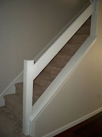 an empty staircase leading up to the second floor in a home with carpeted stairs