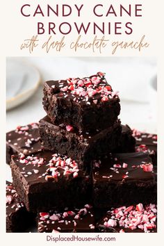 chocolate candy cane brownies with sprinkles stacked on top of each other