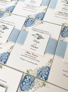 wedding stationery with blue and white flowers on the front, back and side panels