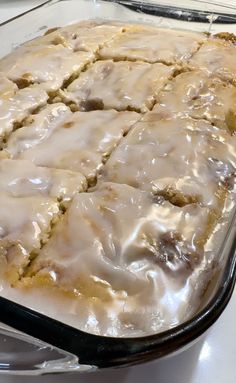 a glass baking dish filled with frosting on top of a counter