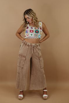 Radiate retro vibes with the Down For It Distressed Cargo Pants from our Patchwork collection. With their vintage inspired distressing these pants effortlessly capture a timeless and trendy aesthetic. Mineral wash Cargo style Elastic waistband Adjustable tie waistband Functional pockets Cropped Fabric: 100% cotton Imported INSEAM: Small: 25 1/2 Medium: 26 Large: 26 Model Specs: Emily is wearing a size small in the photo. How will this item fit you? Check out our MODEL SPECS(Typical Sizing - Karl Vintage Wide Leg Cargo Pants For Summer, Retro Cargo Pocket Bottoms For Spring, Casual Washed Brown Bottoms, Casual Brown Washed Bottoms, Hippie Style Brown Bottoms For Spring, Hippie Brown Bottoms For Fall, Retro Brown Pants For Spring, Retro Relaxed Fit Brown Bottoms, Retro Brown Bottoms With Relaxed Fit