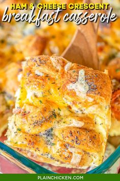 a casserole dish with cheese and herbs in it is being lifted from the casserole dish