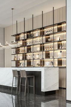 an elegant bar with white marble counter tops