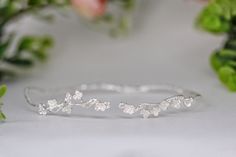 This beautiful choker is made out of a detailed branch design, loaded with lots of little intricate cherry blossom flowers. The branch base is flexible and adjustable. The cherry blossom symbolizes a time of renewal, optimism, beauty, spring, and new beginnings. This piece is meant to carry that energy. Measurements: The circumference is approximately 11 inch / 28 cm. Pls measure your neck to make sure this is a good fit. * Comes wrapped in a beautiful gift bag/box.* Available in 14k gold, rose gold or silver plated brass. For updates, new products, one-of-a-kind's, special offers and more-like us on Facebook:https://www.facebook.com/avigailadamjewellery Follow me on Instagram: https://instagram.com/avigailadamjewelry/ Sakura Branch, Floral Choker, Ring Wreath, Goddess Crown, Beautiful Chokers, Hair Chains, Floral Branch, Branch Design, Cherry Blossom Flowers