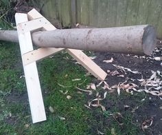 a large log laying on top of a pile of wood