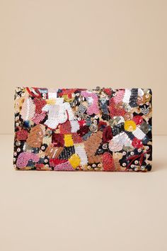 The Lulus Earthly Gardens Beige Multi Beaded Clutch is a fashion statement! Woven soft fabric, in a beige, black, and yellow floral print forms this unique clutch embellished with shiny sequins, beads, and rhinestones in pink, white, red, silver, and orange hues. Open the magnetic closures to reveal a structured interior with a sidewall pocket. Carry as a clutch or attach the matching gold snake chain strap. Patterns may very. Lined. Clutch Measures 9. 5" Wide, 6" Tall, And 0. 5" Deep. Detachabl Chic Yellow Clutch For Party, Multicolor Sequined Evening Clutch, Summer Party Beaded Clutch, Embellished Clutch For Summer Evenings, Embroidered Multicolor Clutch For Party, Summer Party Embellished Clutch, Spring Party Beaded Clutch, Multicolor Clutch For Evening In Spring, Chic Multicolor Clutch For Spring