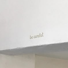 the word be careful is written on the wall