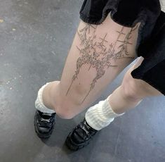 a person with a tattoo on their leg