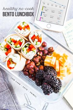 a plastic container filled with lots of different types of food next to a tablet computer