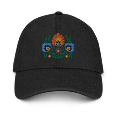 Inspired by Polish Wycinanki art, our Embroidered Denim Dad Hat blends tradition with modern style. Vibrant colors and detailed embroidery make it a unique accessory. Crafted for comfort and versatility, this hat is perfect for any occasion. Elevate your look with a touch of Polish flair! Complement your everyday wardrobe with this pigment-dyed denim hat! Made out of 100% cotton, the 6-panel cap offers a light feel, while the adjustable strap ensures a solid and comfortable fit. Embroidered Cotton Hat With Curved Brim, Black Embroidered Cotton Hat, Embroidered Black Cotton Hat, Casual Embroidered Festival Hats, Traditional Embroidered Hats For Spring, Traditional Embroidered Spring Hats, Traditional Embroidered Baseball Cap, Polish Heritage, Dyed Denim