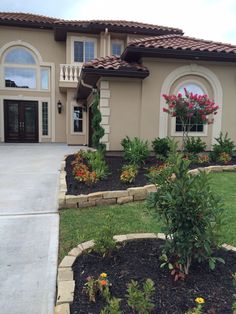 a house with landscaping in front of it