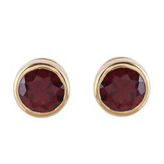 Bathed in 22k gold with a high-polish finish sterling silver frames two stones of faceted garnet. Alok Jain presents this sparkling pair of stud earrings crafted by local artisans. Gold Earrings With Ruby Birthstone, Gold Garnet Earrings Fine Jewelry, Gold Ruby Earrings With Birthstone, Classic Gold Ruby Earrings, Yellow Gold Garnet Round Earrings, Gold Faceted Ruby Earrings, Gold Faceted Garnet Earrings, Gold Garnet Faceted Earrings, Faceted Garnet Earrings In Gold