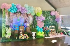 an indoor party with balloons and decorations