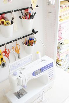 a sewing machine sitting on top of a white table